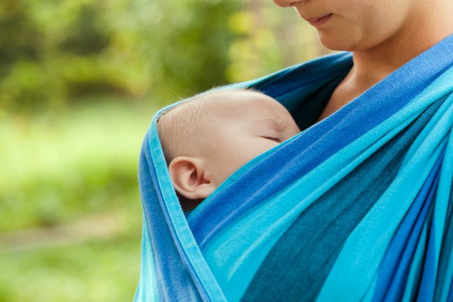 baby-is-sleeping-sling-close-up-face