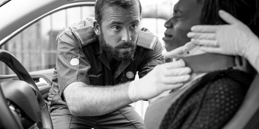 paramedic-placing-cervical-collar-injured-woman-from-car-accident