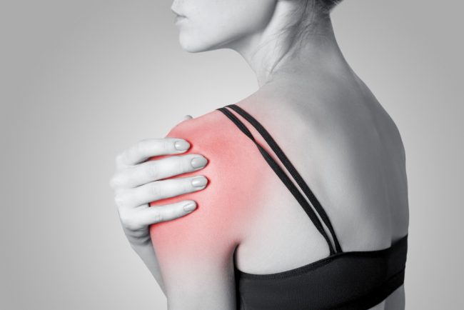 young-woman-with-pain-her-arm-shoulder-gray-background